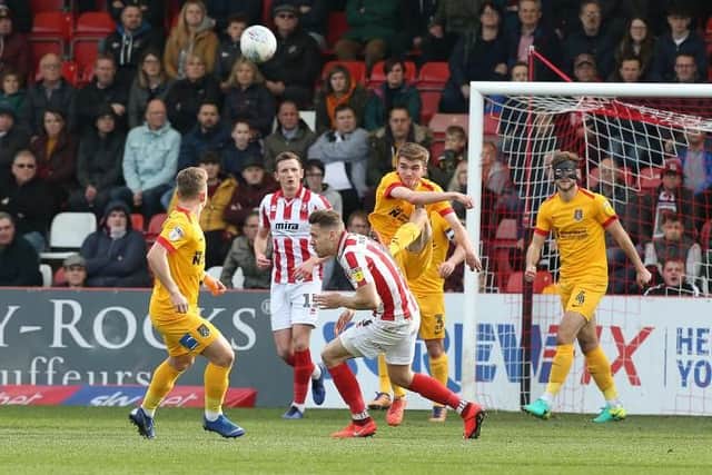Debutant Ryan Hughes sends a clearance downfield. Picture: Pete Norton