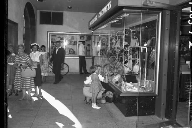 A Mother and a daughter window shopping at Boots new store on the corner of Gold Street and Drapery, Northampton, September 12, 1959