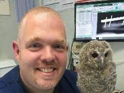 Dr Stephen Smith (left) examined the two peacocks on Wednesday