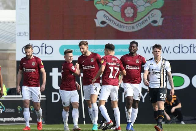 The Cobbles players celebrate Sam Hoskins' early goal