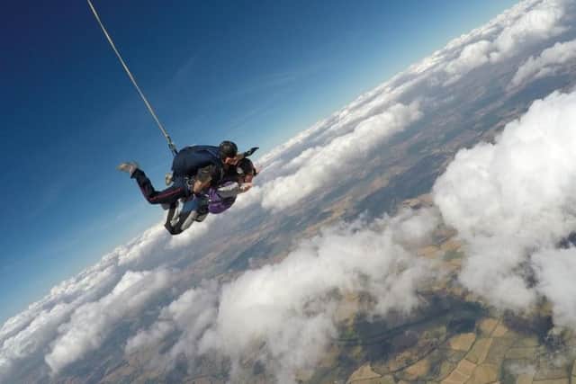 Catherine pictured taking the 13,000ft plunge. Pictures: Insight Magazine NGH.