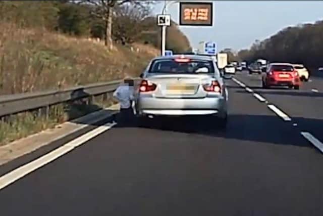 The boy kneels on the M1
