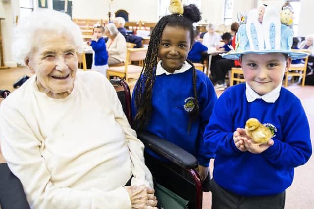 Edna, Amani and Pearse pictured today at St Christopher's Care Home with the chicks.