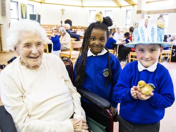 Edna, Amani and Pearse pictured today at St Christopher's Care Home with the chicks.
