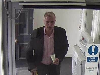 CCTV showing Mabbutt entering a bank with a plan to defraud another customer of their money.