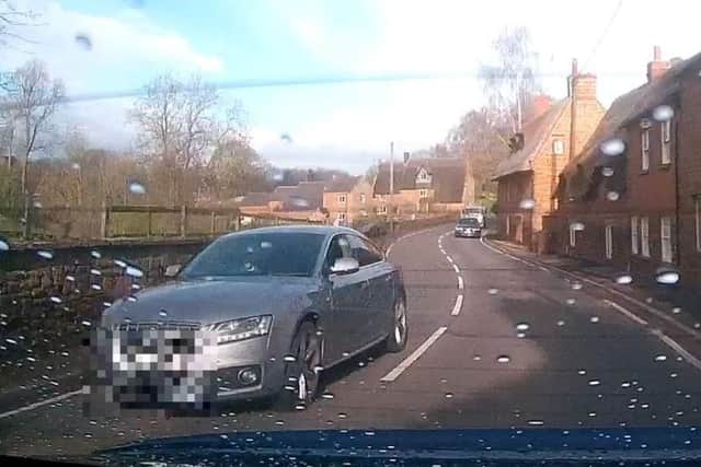 The speeding Audi narrowly avoids the back of a car on the way into a blind bend in Lower Harlestone.