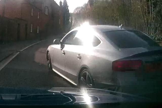 The Audi is then forced to dart to the left to avoid an oncoming car.