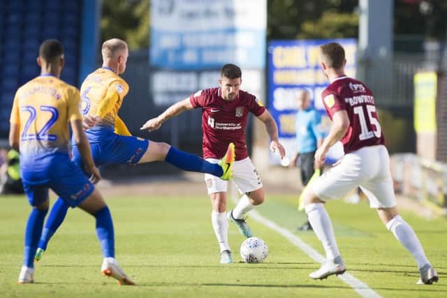 David Buchanan in action during the Cobblers' 4-0 loss at Mansfield in September