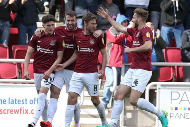 SAM'S THE MAN! Midfielder Sam Foley receives the plaudits after heading the Cobblers level against Mansfield on Saturday.