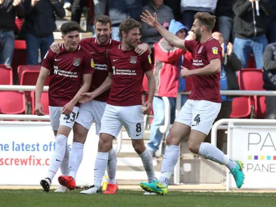 SAM'S THE MAN! Midfielder Sam Foley receives the plaudits after heading the Cobblers level against Mansfield on Saturday.