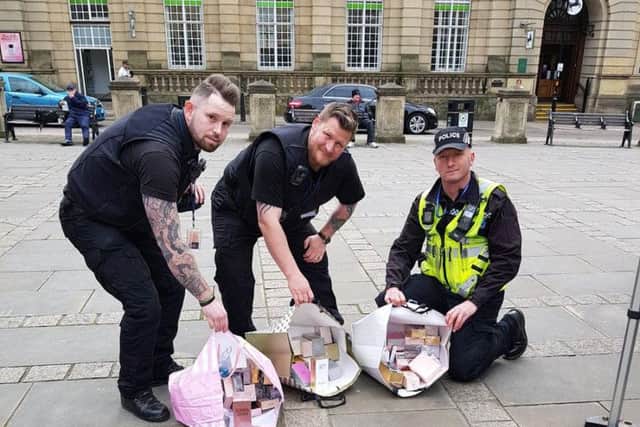 Officers with the fake perfumes and aftershaves