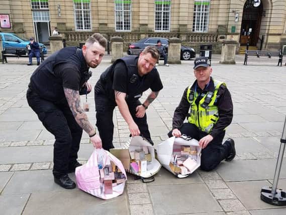 Officers with the fake perfumes and aftershaves
