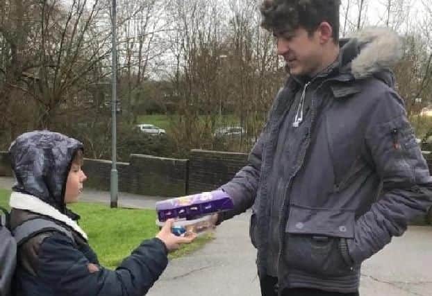 Charlie Johnson pictured giving Nathaniel Clark his thank you presents following the rescue