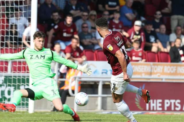 TIDY FINISH: Daniel Powell beats Kieran O'Hara to restore Cobblers' lead. Pictures: Pete Norton