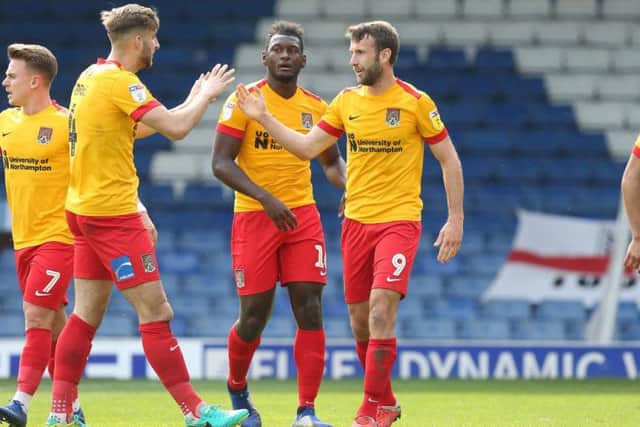 Andy Williams is congratulated after scoring his 10th goal of the season at Gigg Lane on Easter Monday. Picture: Pete Norton