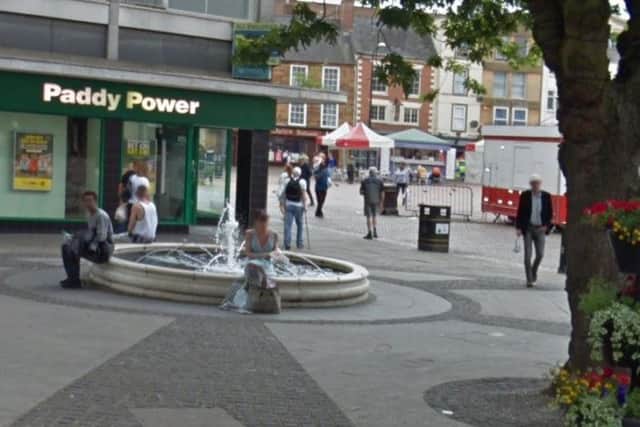 Coulson threatened the schoolgirl with the knife near the fountain on Market Square.