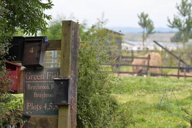 Families at the Greenfields Travellers Site looked out their caravans to see "a small army" coming down their lane.