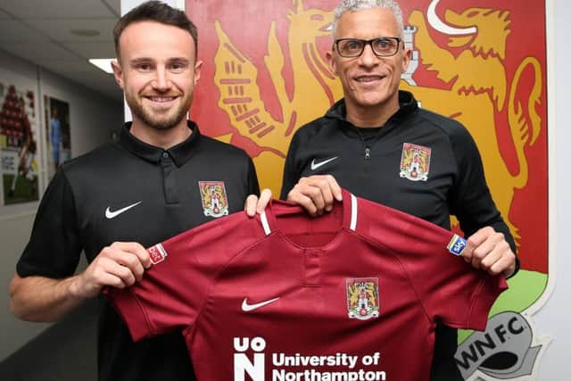 Matt Warburton and Cobblers boss Keith Curle (Picture: Pete Norton)