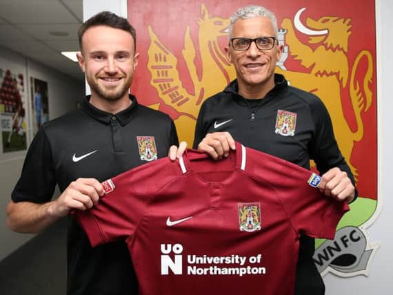 Matt Warburton and Cobblers boss Keith Curle (Picture: Pete Norton)