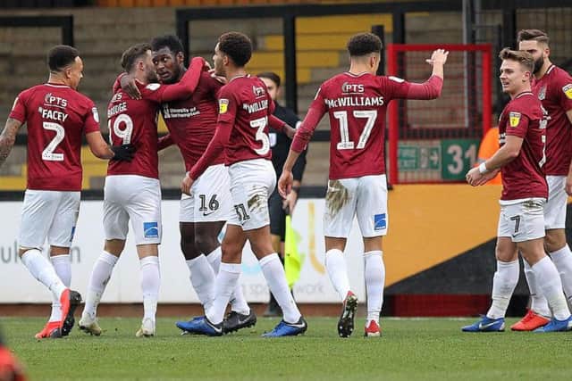 Cobblers celebrate Aaron Pierre's goal at Cambridge