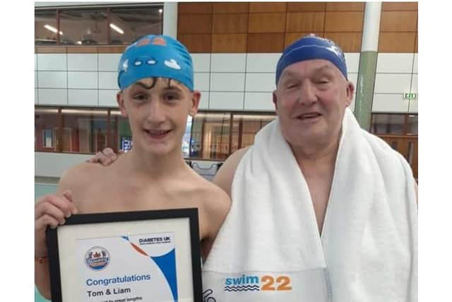 Liam Culley with his grandfather Tom Carr after completing the Swim22 challenge, but the duo aren't stopping there - they're to complete an extra 4.2 miles to make it a marathon