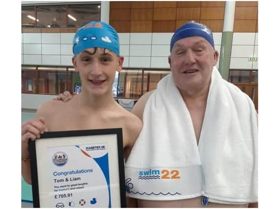 Liam Culley with his grandfather Tom Carr after completing the Swim22 challenge, but the duo aren't stopping there - they're to complete an extra 4.2 miles to make it a marathon