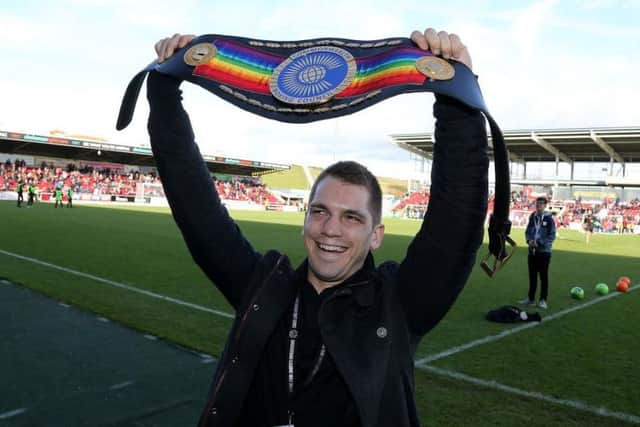 Ash Lane shows off his Commonwealth title at Sixfields (Picture: Pete Norton)