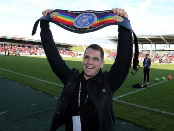 Ash Lane shows off his Commonwealth title at Sixfields (Picture: Pete Norton)