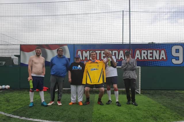 Pictured: Kit sponsor Matt Owen, director of MOSounds, with team coach Lee Cowley and some of the football team players. The photos are taken at Goals who also sponsor and support the team by allowing them free use of all their facilities every Saturday morning.