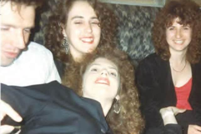 Marie is pictured on the right, wearing a red top and dark jacket sat next to Simone and her husband Neil. Their friend Julie is pictured at the front.