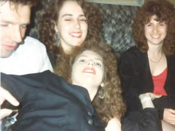 Marie is pictured on the right, wearing a red top and dark jacket sat next to Simone and her husband Neil. Their friend Julie is pictured at the front.