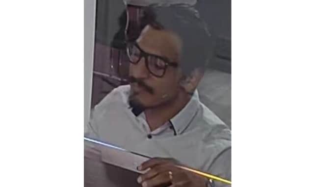 The face of a man police would like to speak to in connection with the theft of two cash cards. NNL-190523-133634005