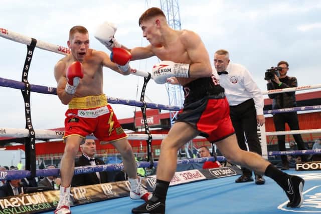 Ash Lane (left) in action against Brad Foster