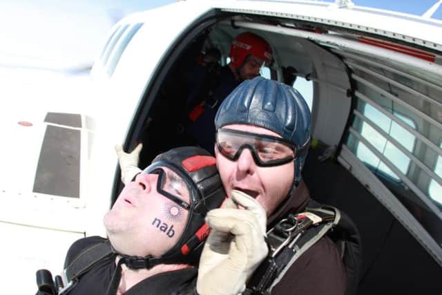 Hugh Spence (left) and his tandem partner Paul Bepey jumped from a plane this week for charity.