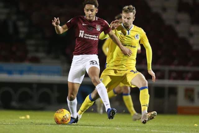 Chris Lines tussles with Jay Williams during Bristol Rovers' 2-1 Checkatrade Trophy win at the Cobblers in January