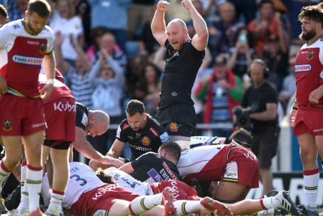 Exeter celebrate scoring their first try