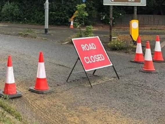 Sandy Lane near the A4500 roundabout has been coned off