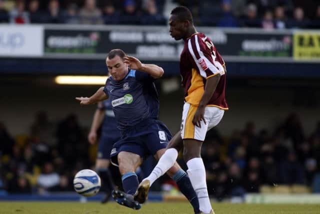 A youthful Alan McCormack challenges Cobblers midfielder Abdul Osman while playing for Southend United