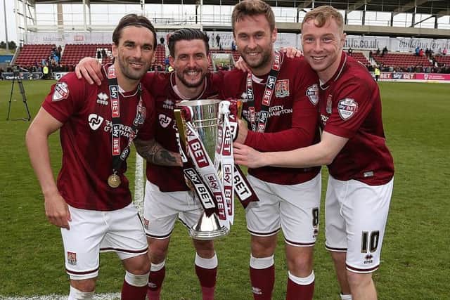 Nicky Adams (far right) celebrates the Cobbleres' 2016 title success, with Ricky Holmes, David Buchanan and Joel Byrom
