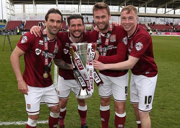 Nicky Adams (far right) celebrates the Cobbleres' 2016 title success, with Ricky Holmes, David Buchanan and Joel Byrom