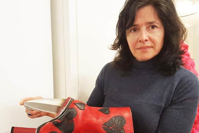 Jo Allen with her boot with a knife heel. Photo: University of Northampton