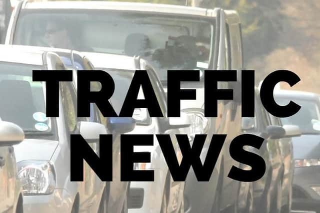 Heavy traffic is building in the town as a sudden rain shower arrives in time for rush hour.