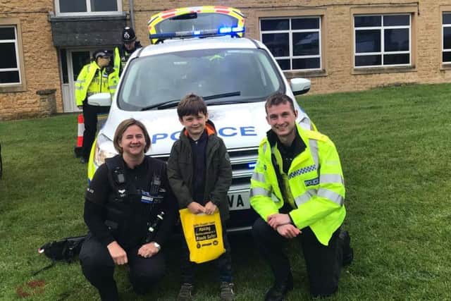 Louie with officers from Brackley at the carnival. Photo: Northamptonshire Police