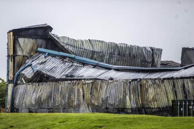 Images taken by Kirsty Edmonds show the logistics centre in the aftermath of the blaze.