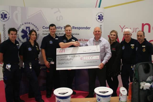 Members of the SNCR team were given a 2,000 cheque to kick off their partnership with Weston Favell.