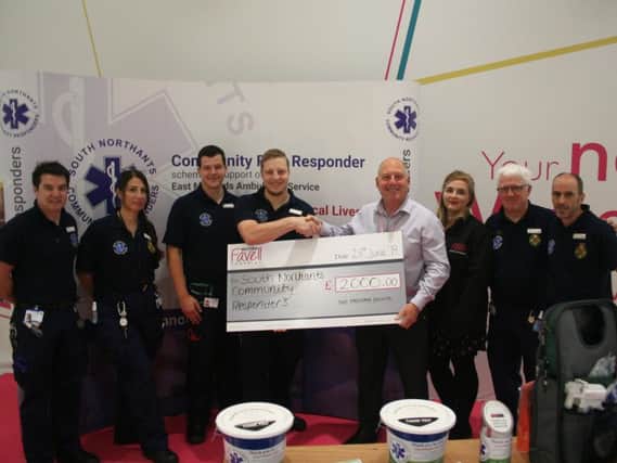 Members of the SNCR team were given a 2,000 cheque to kick off their partnership with Weston Favell.