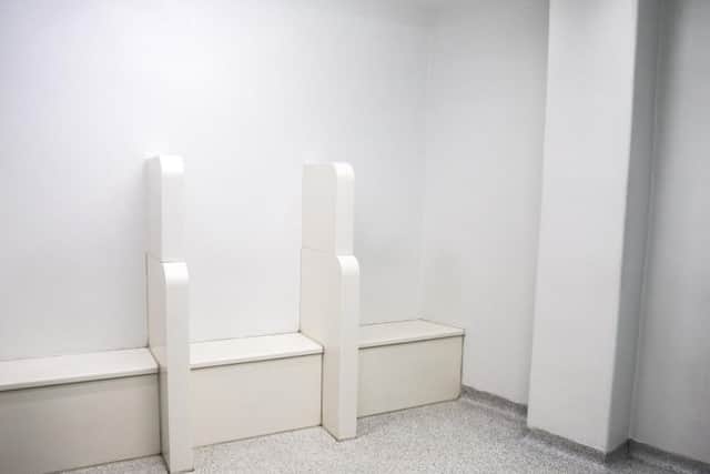 This is where detainees will be brought straight from the police vehicle to wait before being buzzed by the front desk to fill out your paperwork. The clinically white room can hold up to five people.