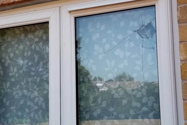 The rock shattered the first pane of double glazing and rebounded.