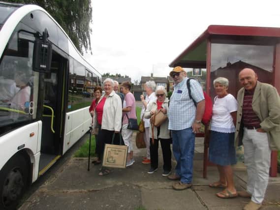 Residents photographed yesterday by Joan Toy getting on the bus service.
