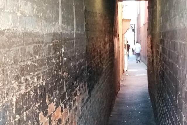 A plan is underway to close the alleyway off the Drapery for good.
